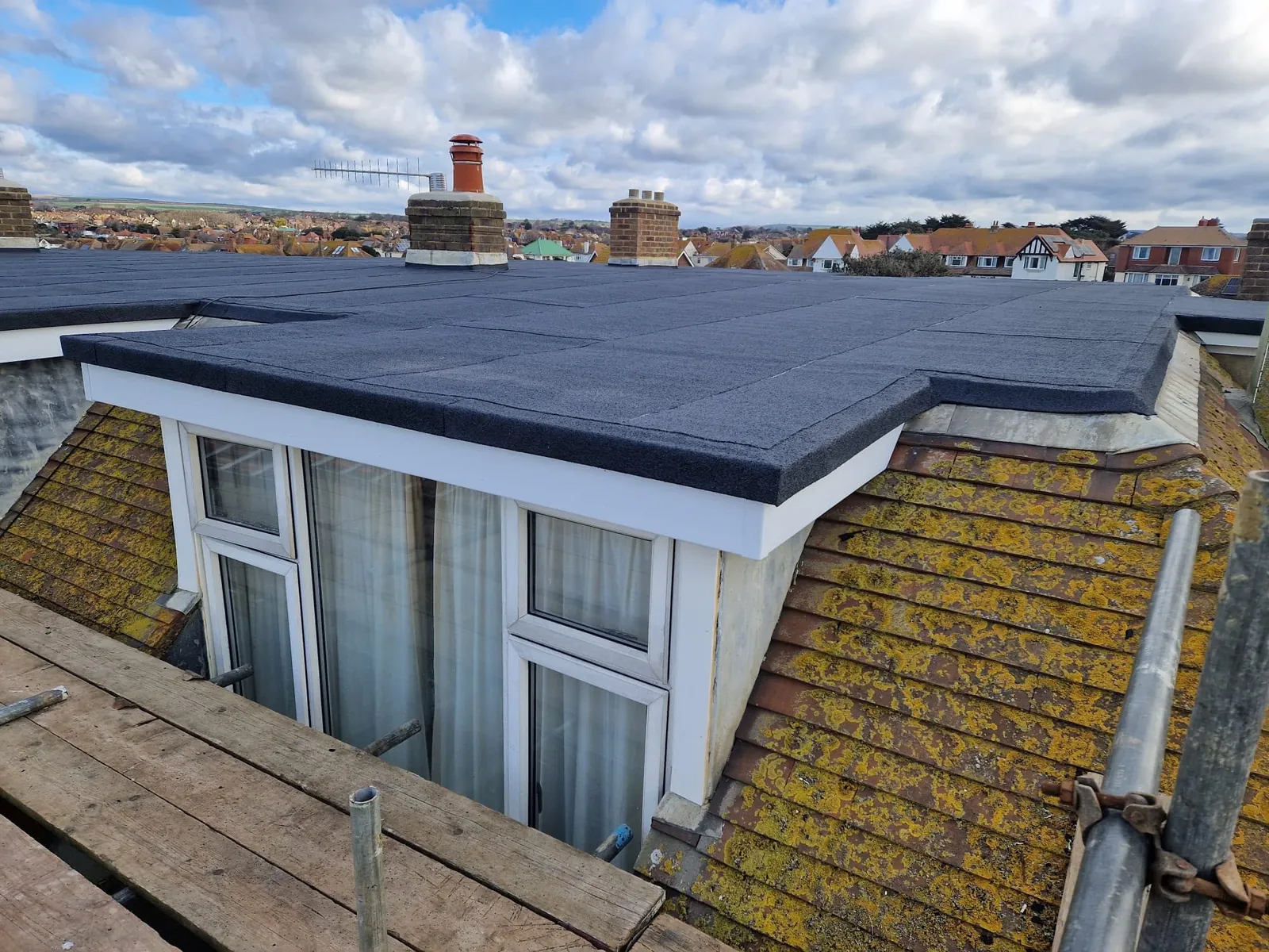 New felt flat roof on a dormer with white fascias in Leicester