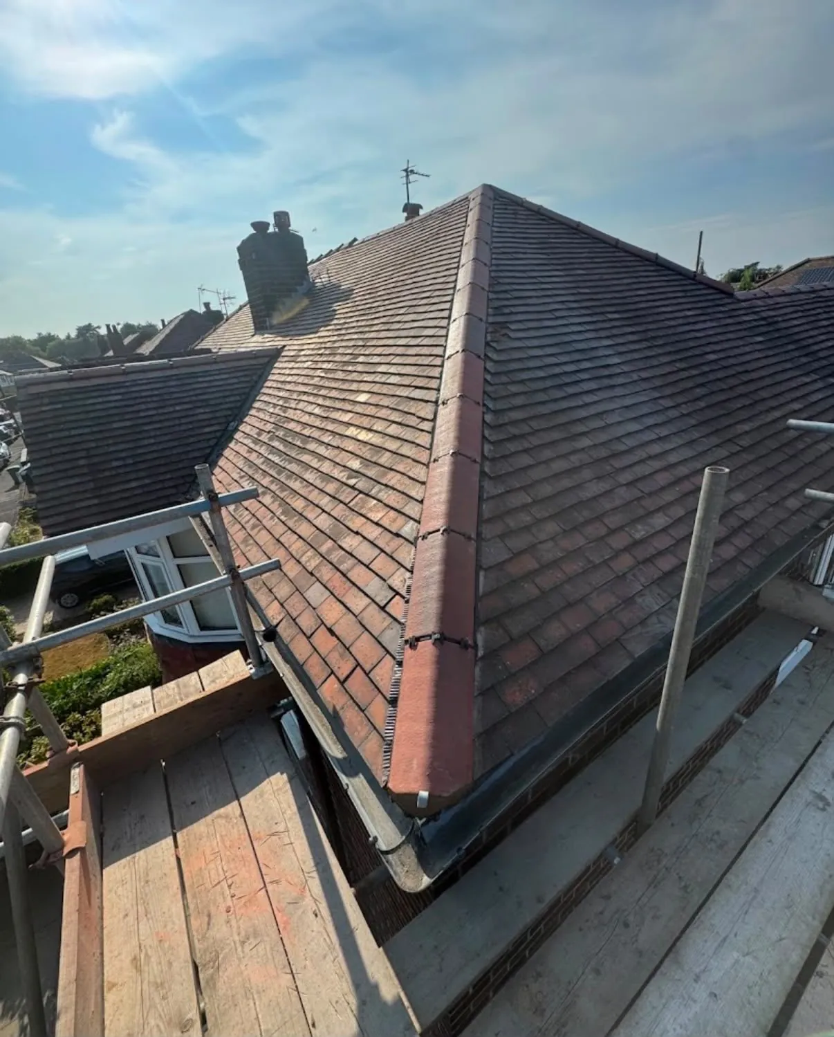 Re-tiled clay hip roof with new hip tiles in Leicester