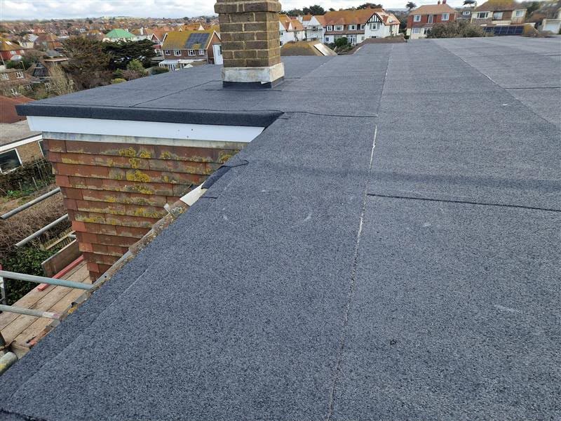 Felt flat roof repair around a chimney stack in Leicester