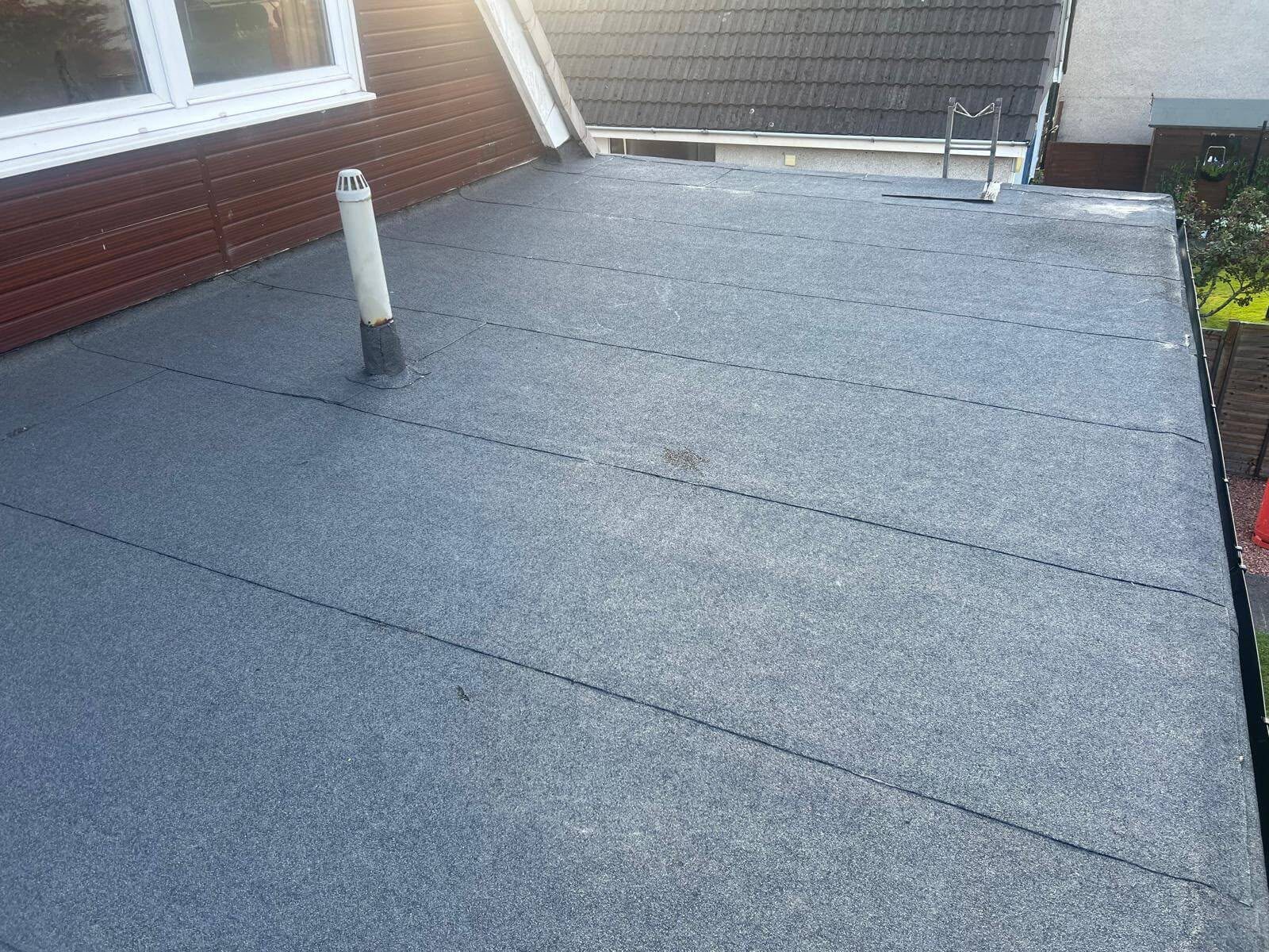 Repaired mineral felt flat roof with sealed vent pipe in Leicester
